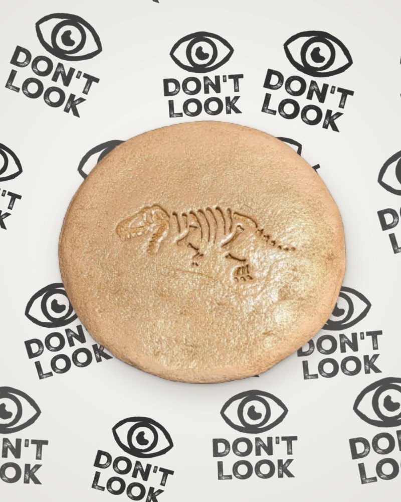 T-Rex fossil coaster in gold