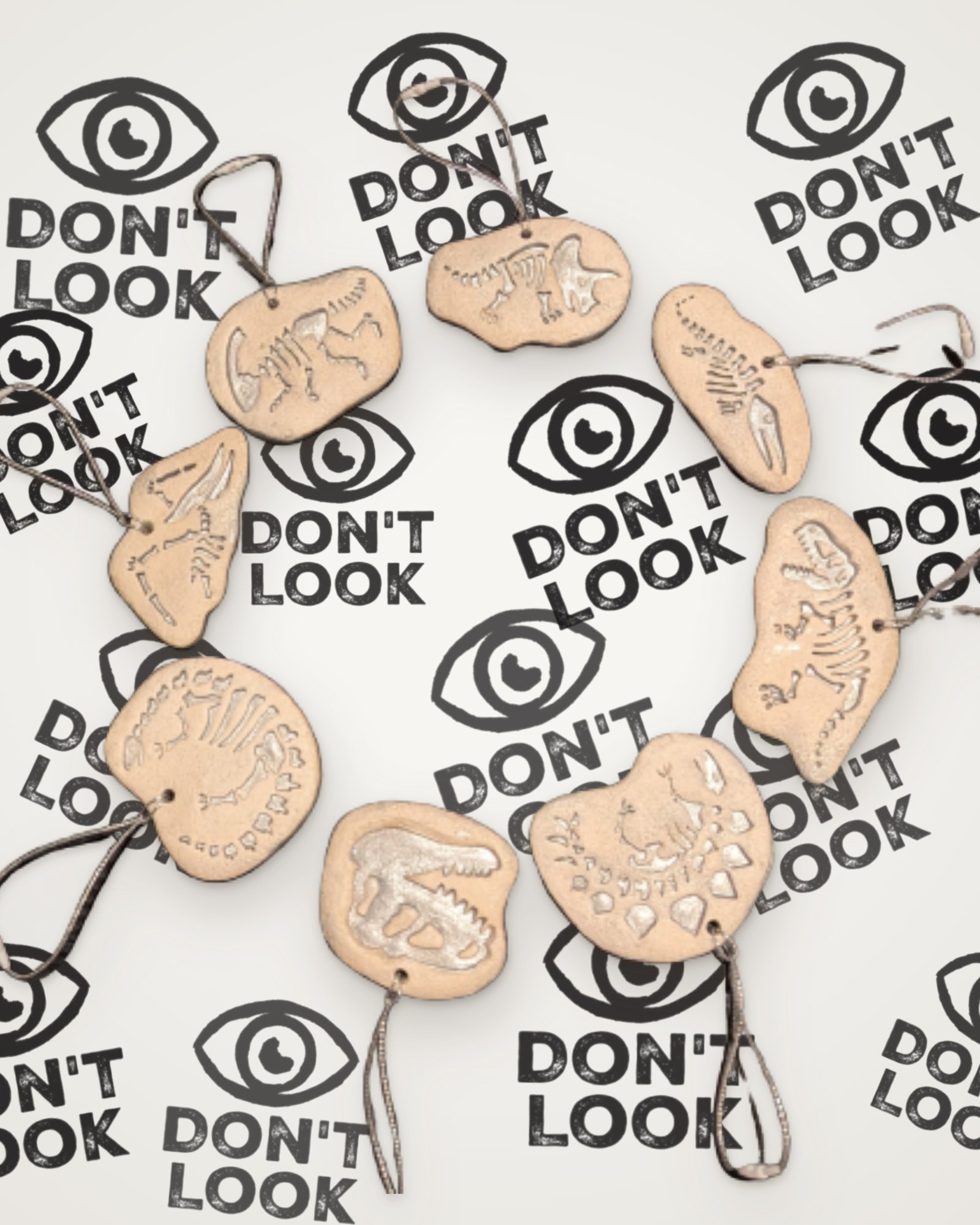 Set of 8 Dinosaur fossil Christmas tree decorations with silver details