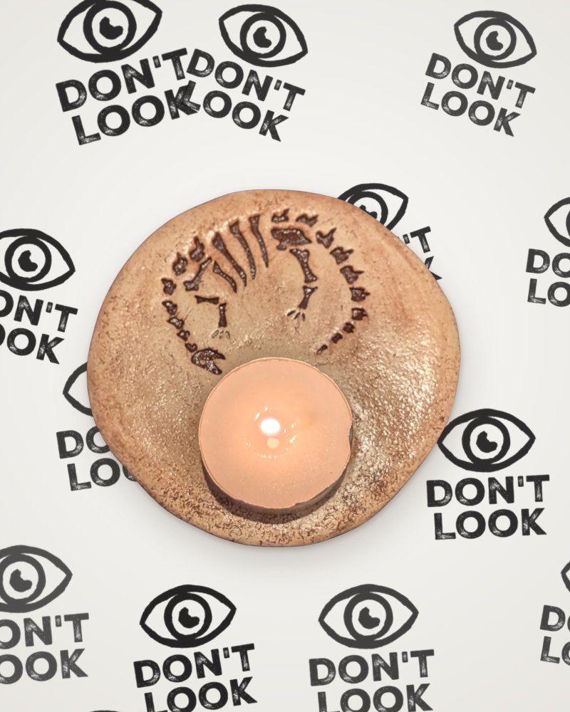 Diplodocus fossil tealight holder in brown