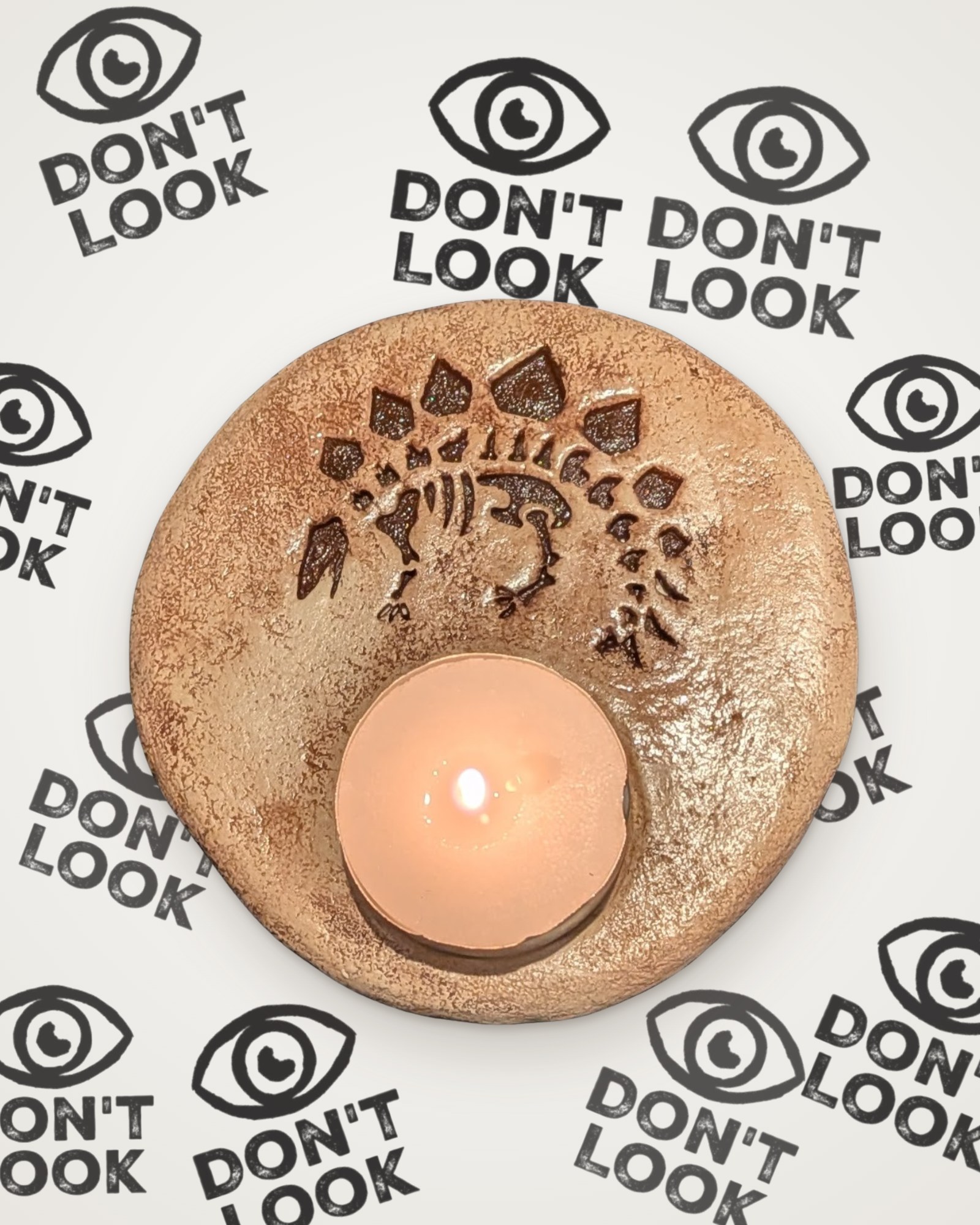 Stegosaurus fossil tealight holder in brown