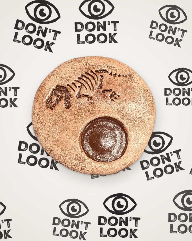 T-Rex fossil tealight holder in brown