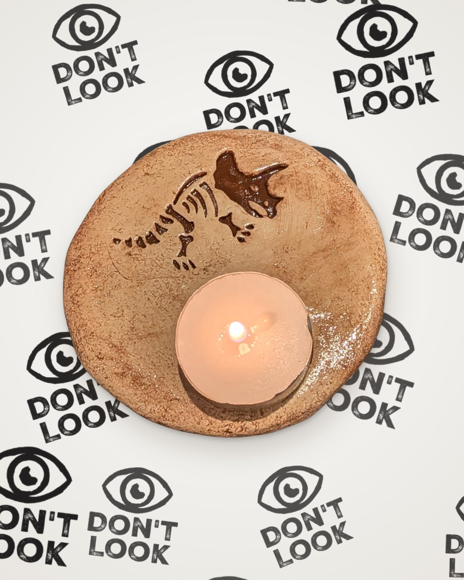 Triceratops tealight holder in brown